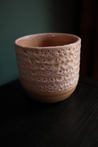 Blush pink ripple-textured ceramic planter by Ivyline, 13cm tall and 13cm wide with a soft glazed finish